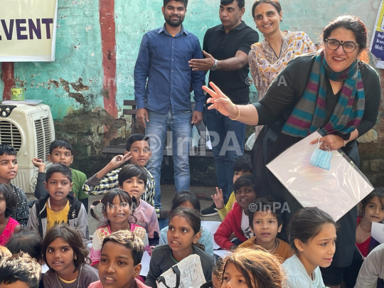 Dr. Gunita Singh with kids of coolie camp