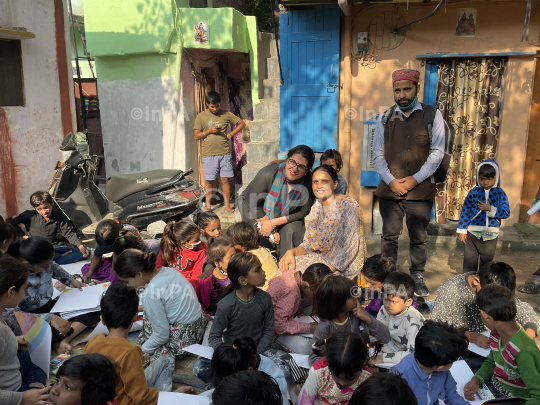 Dr. Gunita Singh with kids of coolie camp