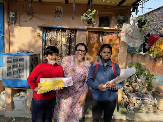 Dr. Gunita Singh with kids of coolie camp