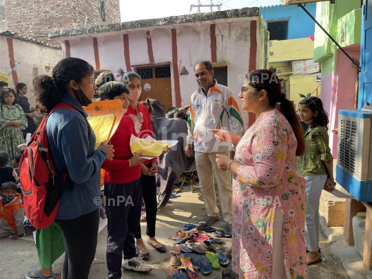 Dr. Gunita Singh with kids of coolie camp