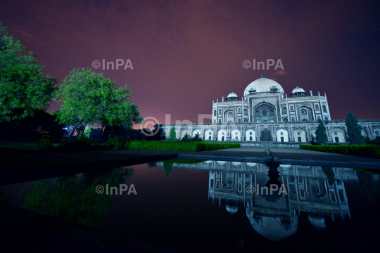 Humayun tomb being illuminated in blue