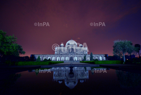 Humayun tomb being illuminated in blue