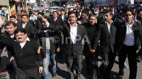 Lawyers took out a rally in the city demanding rollback of Jammu