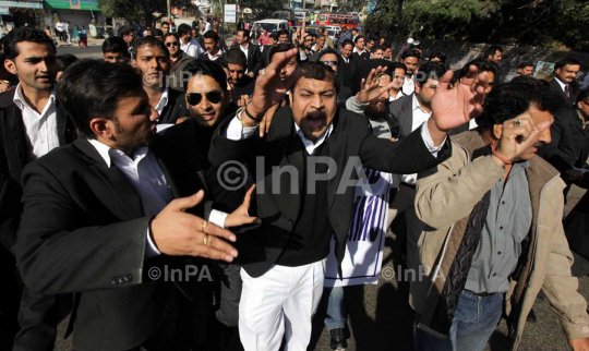 Lawyers took out a rally in the city demanding rollback of Jammu