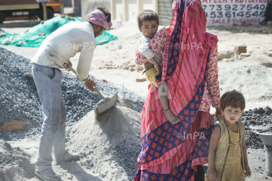 Mother with child: Construction worker