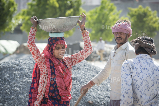 Mother with child: Construction worker